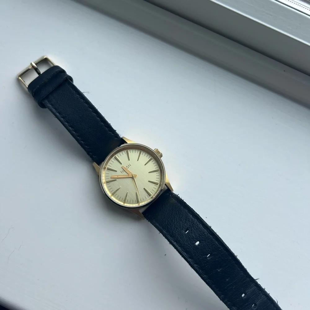 Nixon Gold-Tone Case with Black Leather Strap Watch